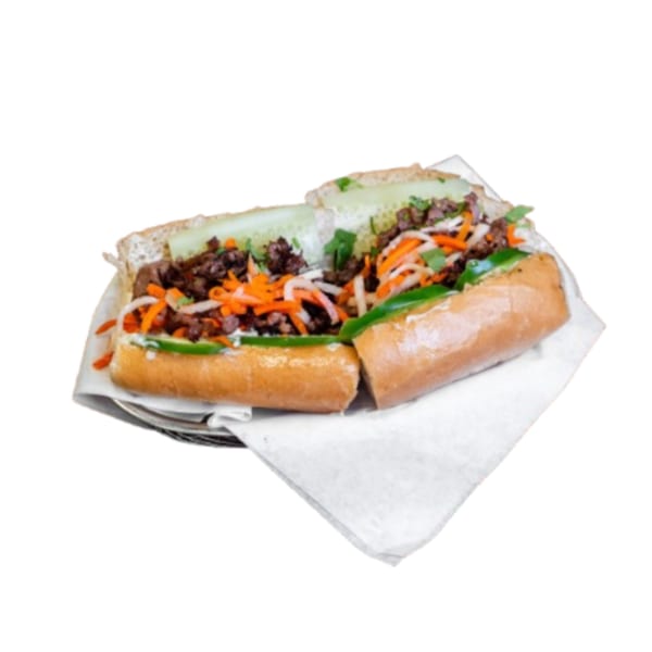 Vietnamese Banh Mi sandwich with grilled beef, pickled carrots, daikon, cucumber, and jalapeños.