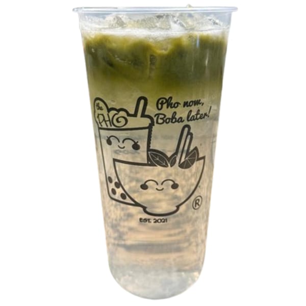 Iced green tea drink in a clear plastic cup with "The PHO" branding and "Pho now, Boba later!" text.